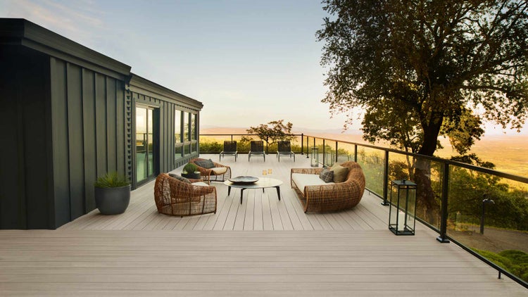 Custom deck installation in Topeka KS with modern railing and outdoor seating