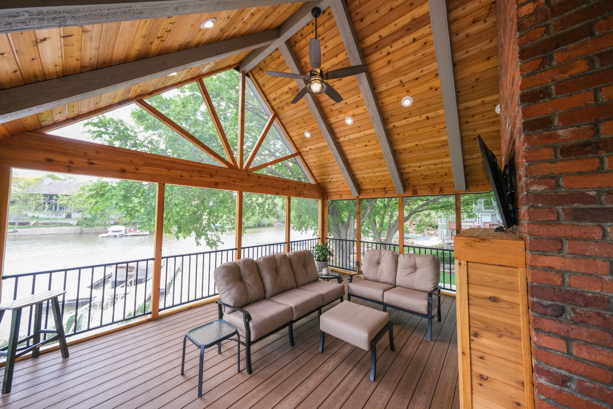 Custom Screened Porch in Topeka KS | WD Remodeling Custom screened porch overlooking the water with vaulted wood ceiling and exposed beams in Topeka, Kansas